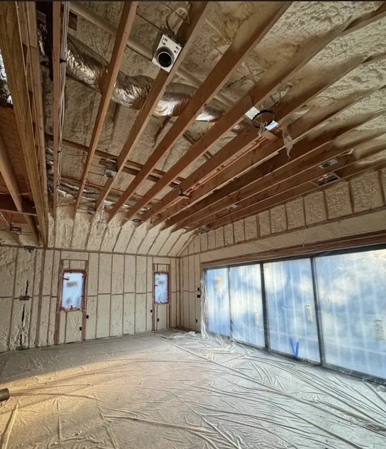 Interior walls and ceiling insulated with spray foam during new construction in Rockland